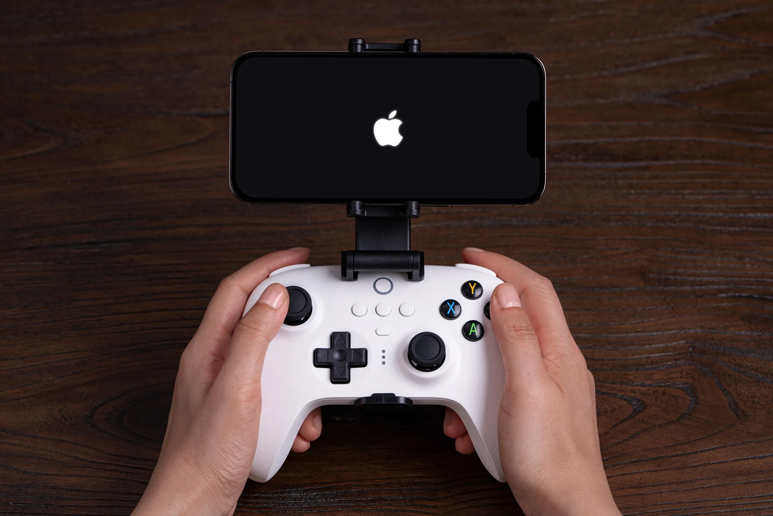 Apple and Beats logos alongside a smartphone game controller
