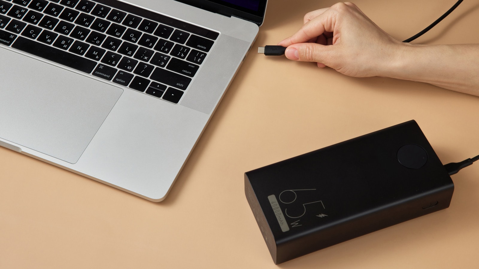 A laptop connected to a portable power bank