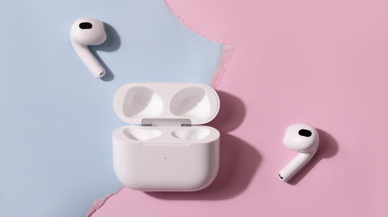 AirPods Pro 3 alongside their charging case on a pink and blue background.