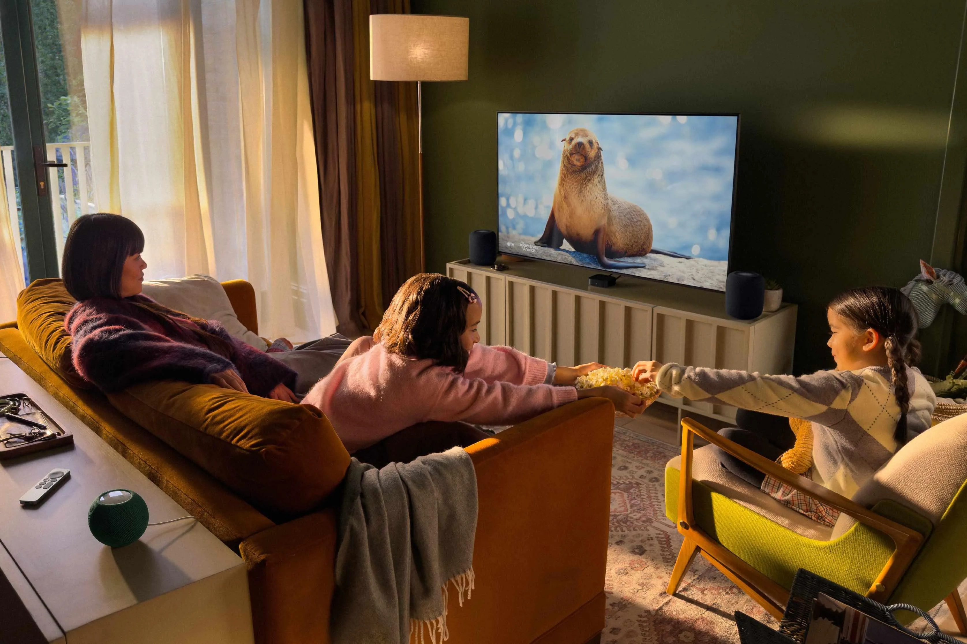 The new Apple TV 4K device next to its Siri Remote