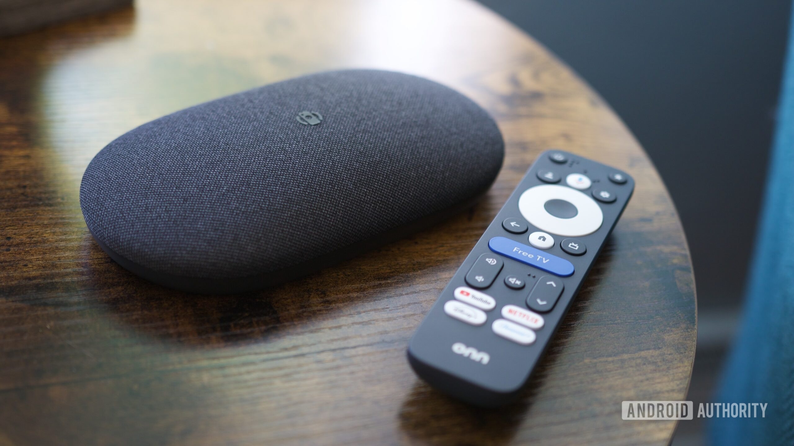 Apple TV 4K device on a minimalist background