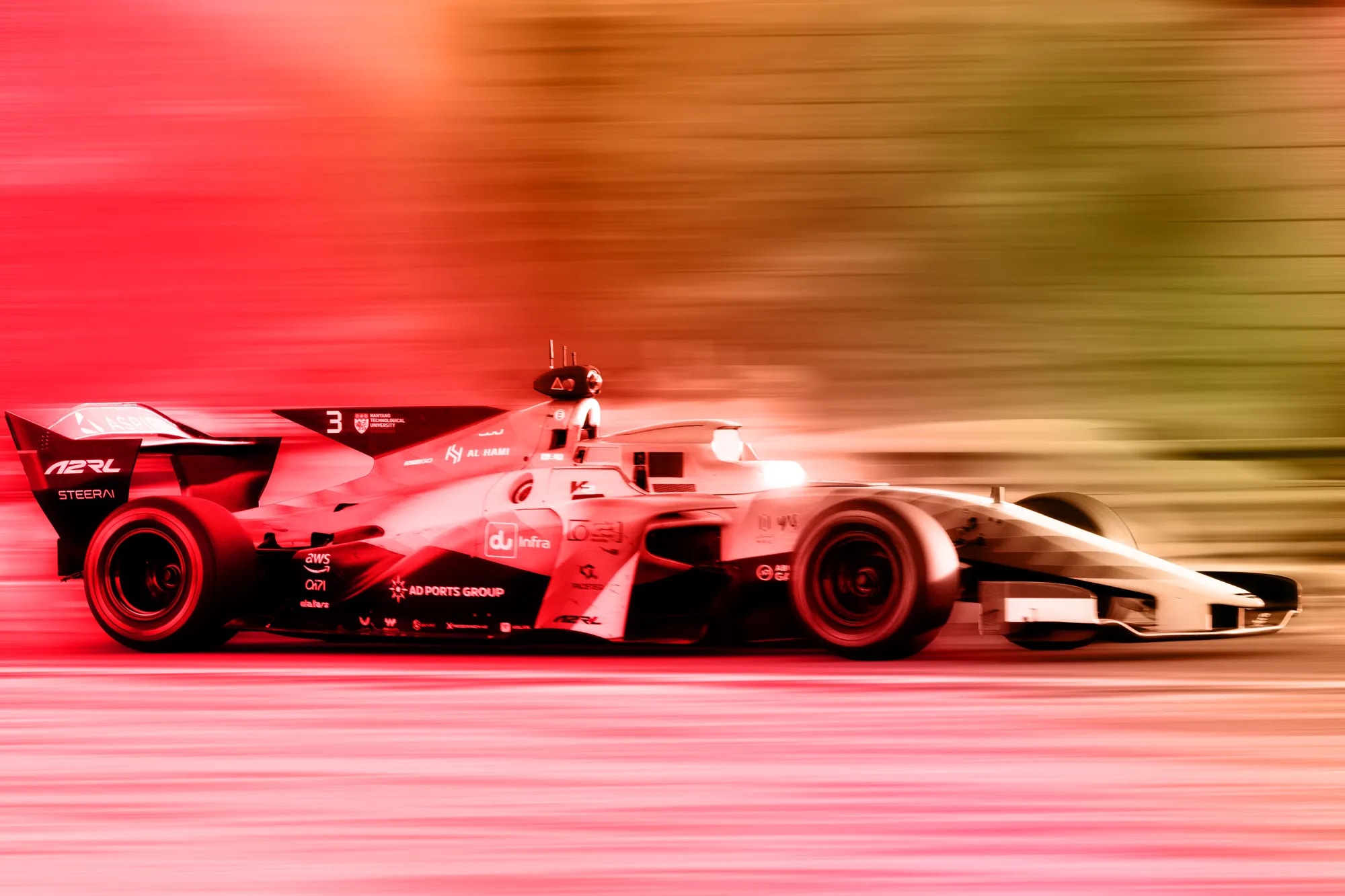 Autonomous race cars competing on a Formula 1 track