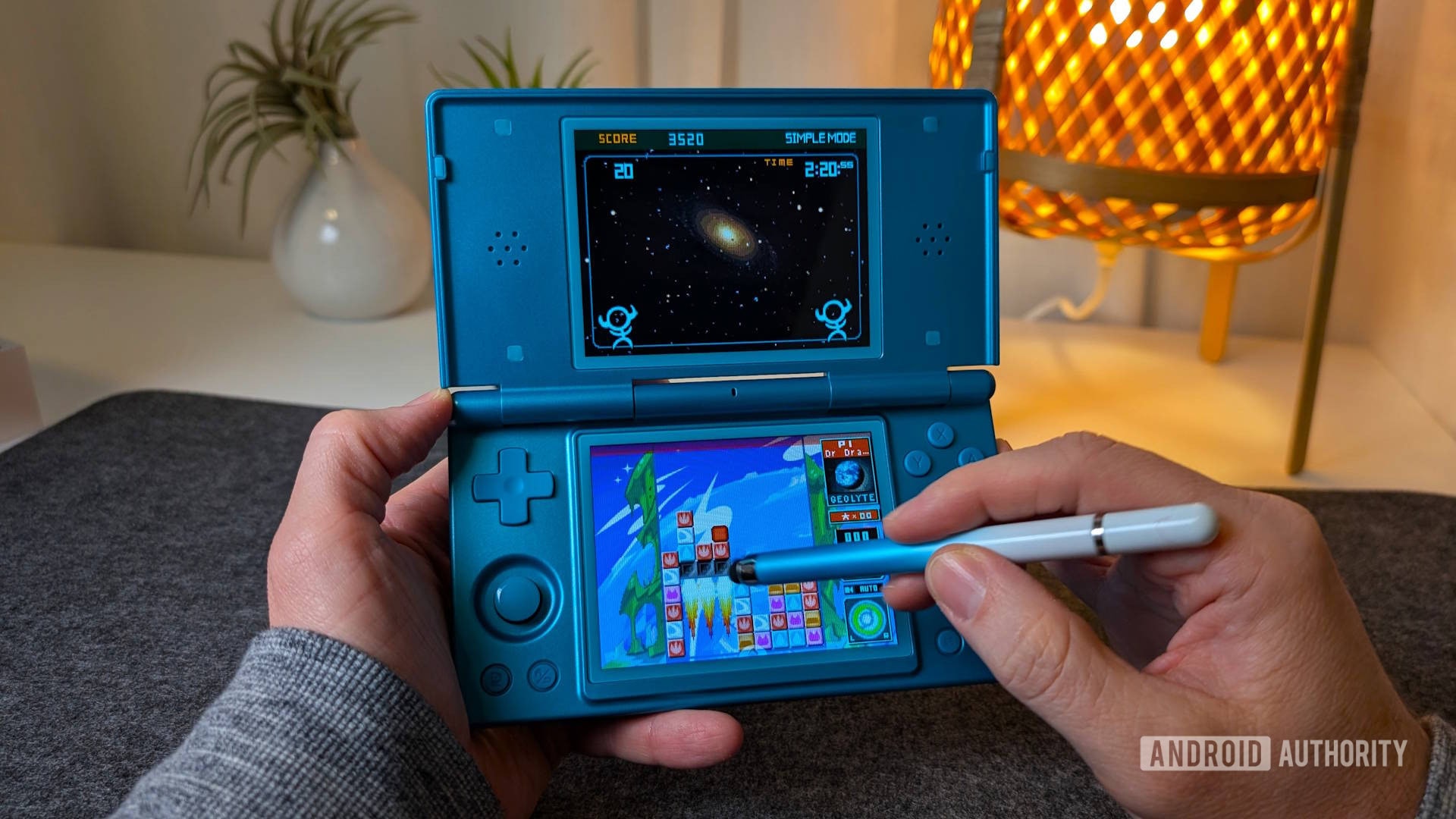 A handheld gaming console showing the Blip interface