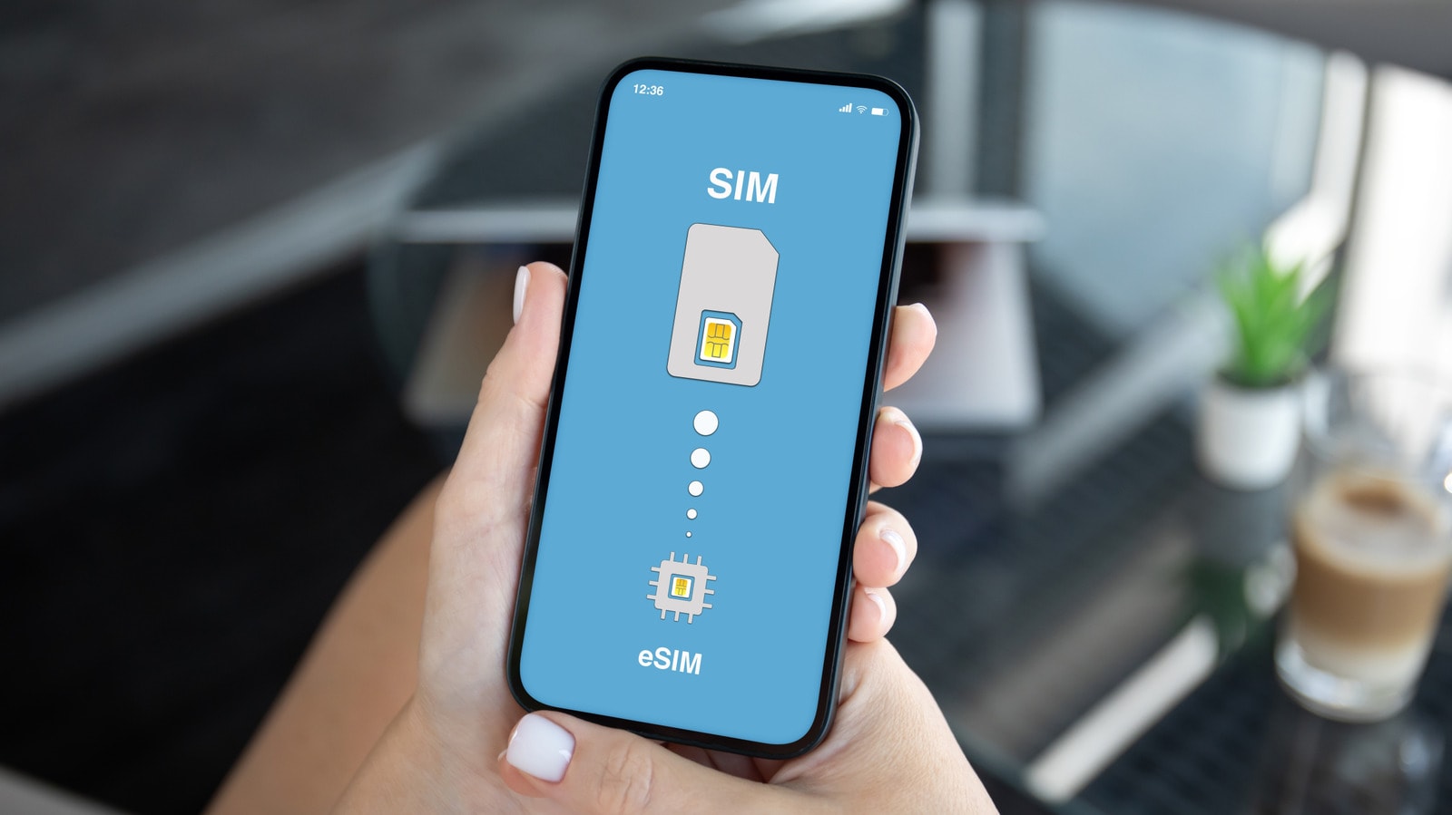 A close-up of a smartphone screen showing eSIM activation settings next to a physical SIM card.
