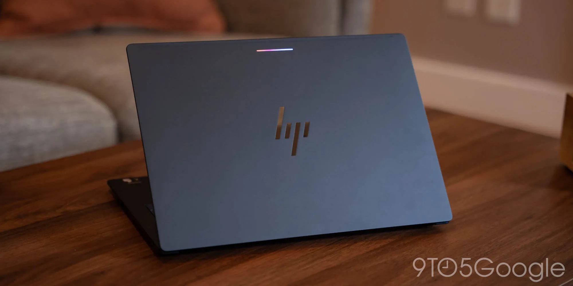 The HP Googlebook 14 laptop showing its slim aluminium profile and OLED display.