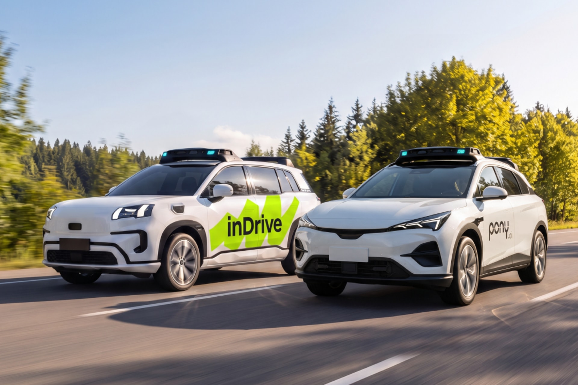 An inDrive branded autonomous vehicle on a city street.