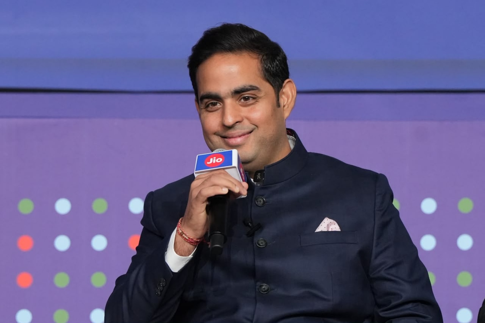 Jio Platforms logo and stock market trading charts