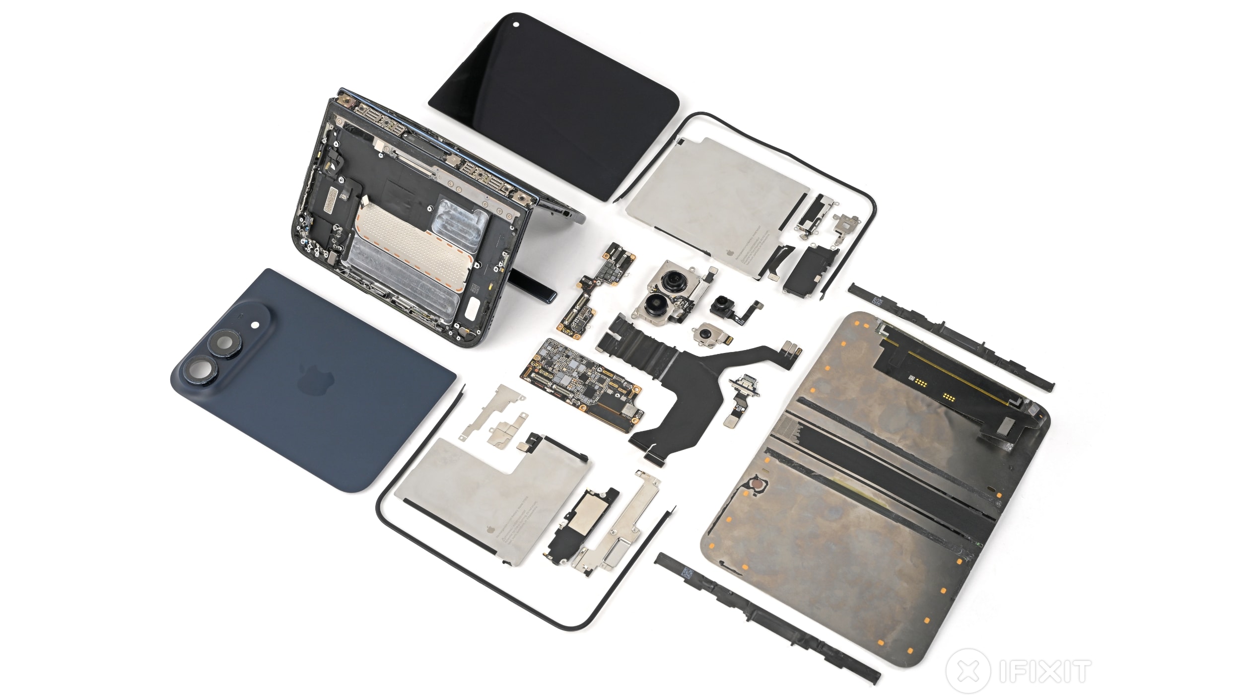 The internal components of the iPhone Duo displayed during an iFixit teardown.