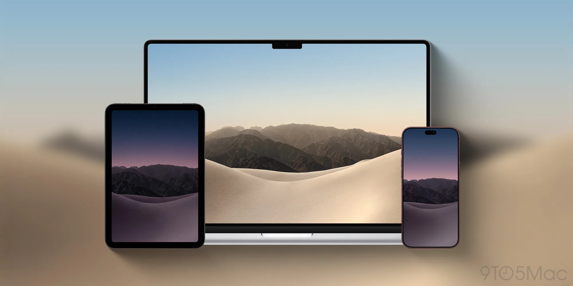 The official iPhone Duo wallpaper featuring desert dunes and a mountain landscape.