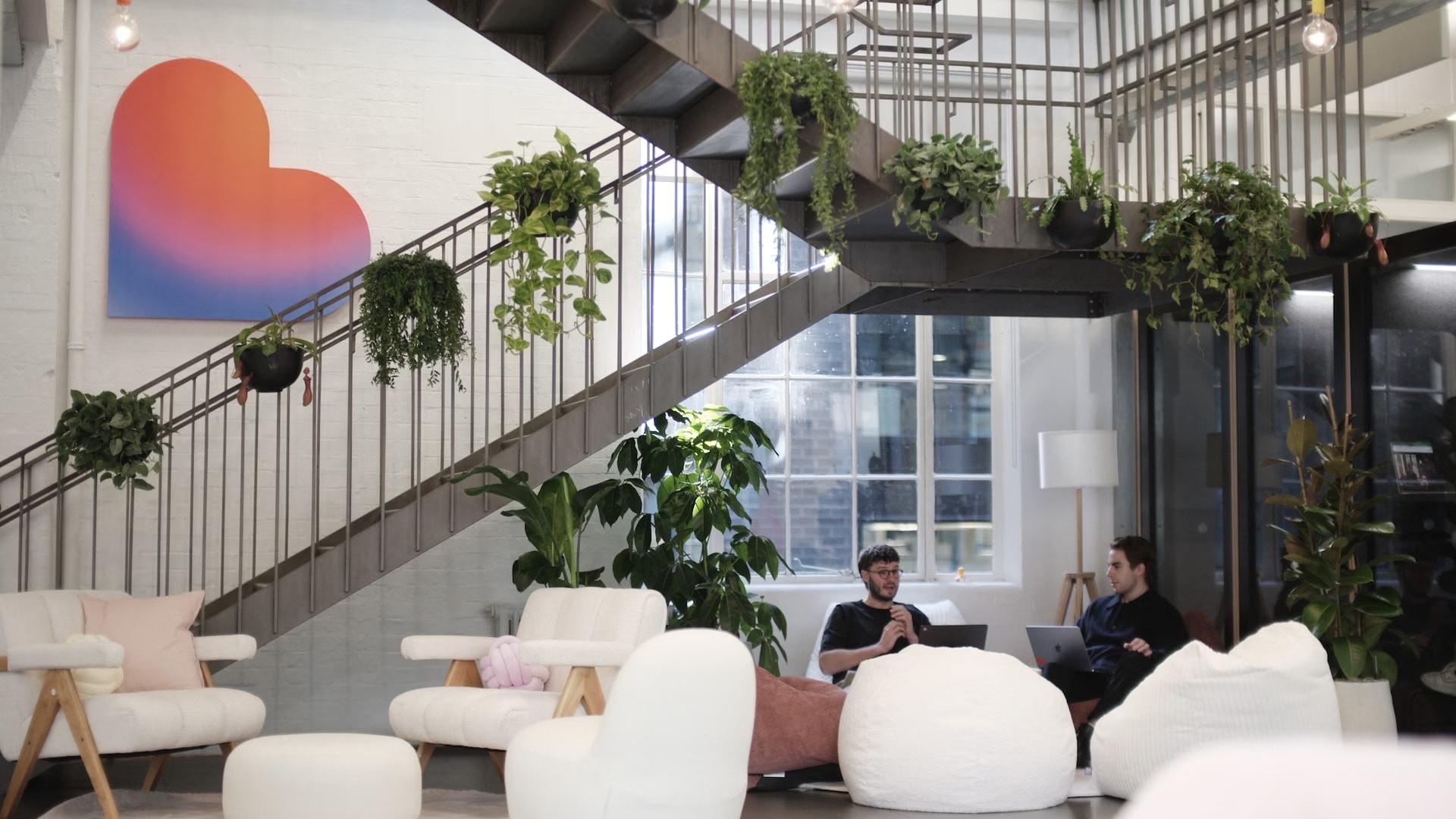 The Lovable logo displayed on a modern office wall in London.