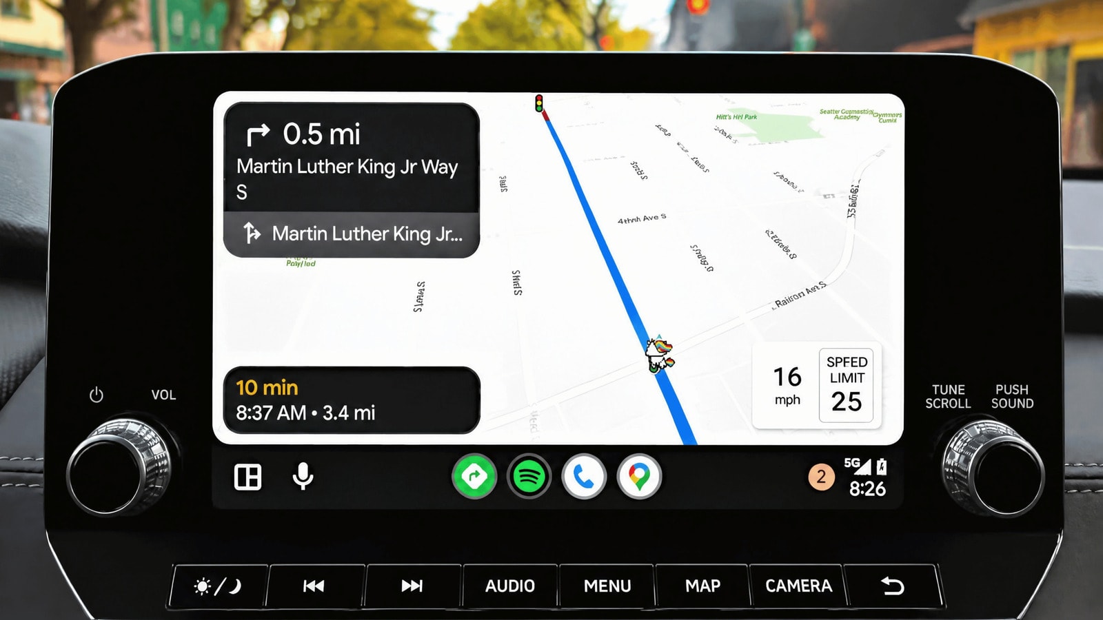 MapQuest logo on a smartphone screen inside a car