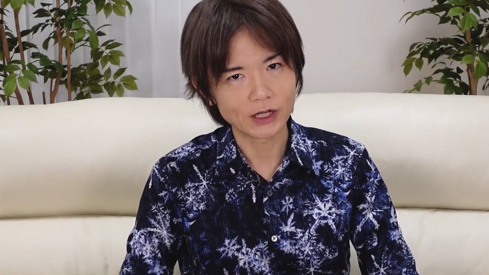 Masahiro Sakurai speaking at a gaming event