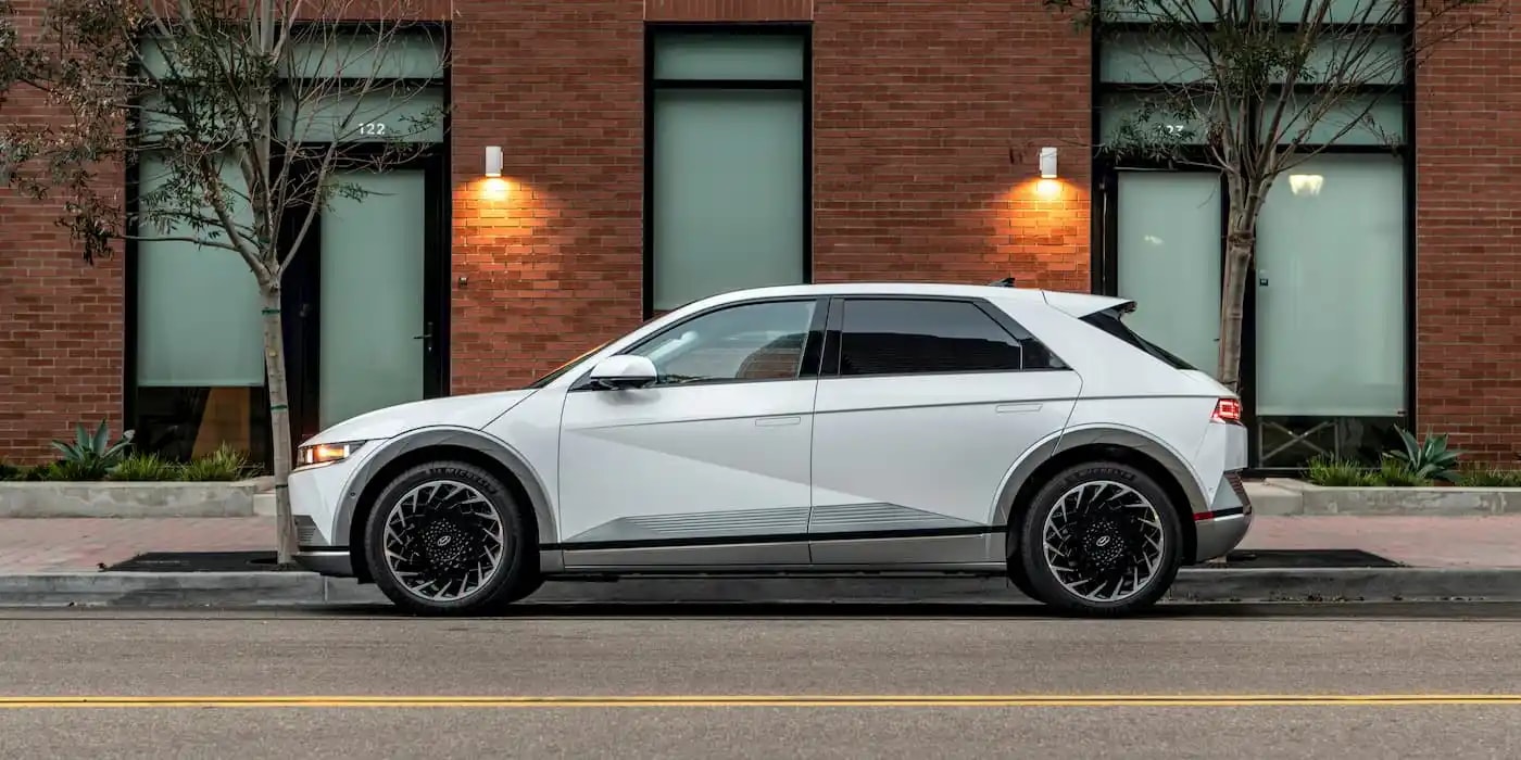 A lineup of modern electric SUVs parked in a row