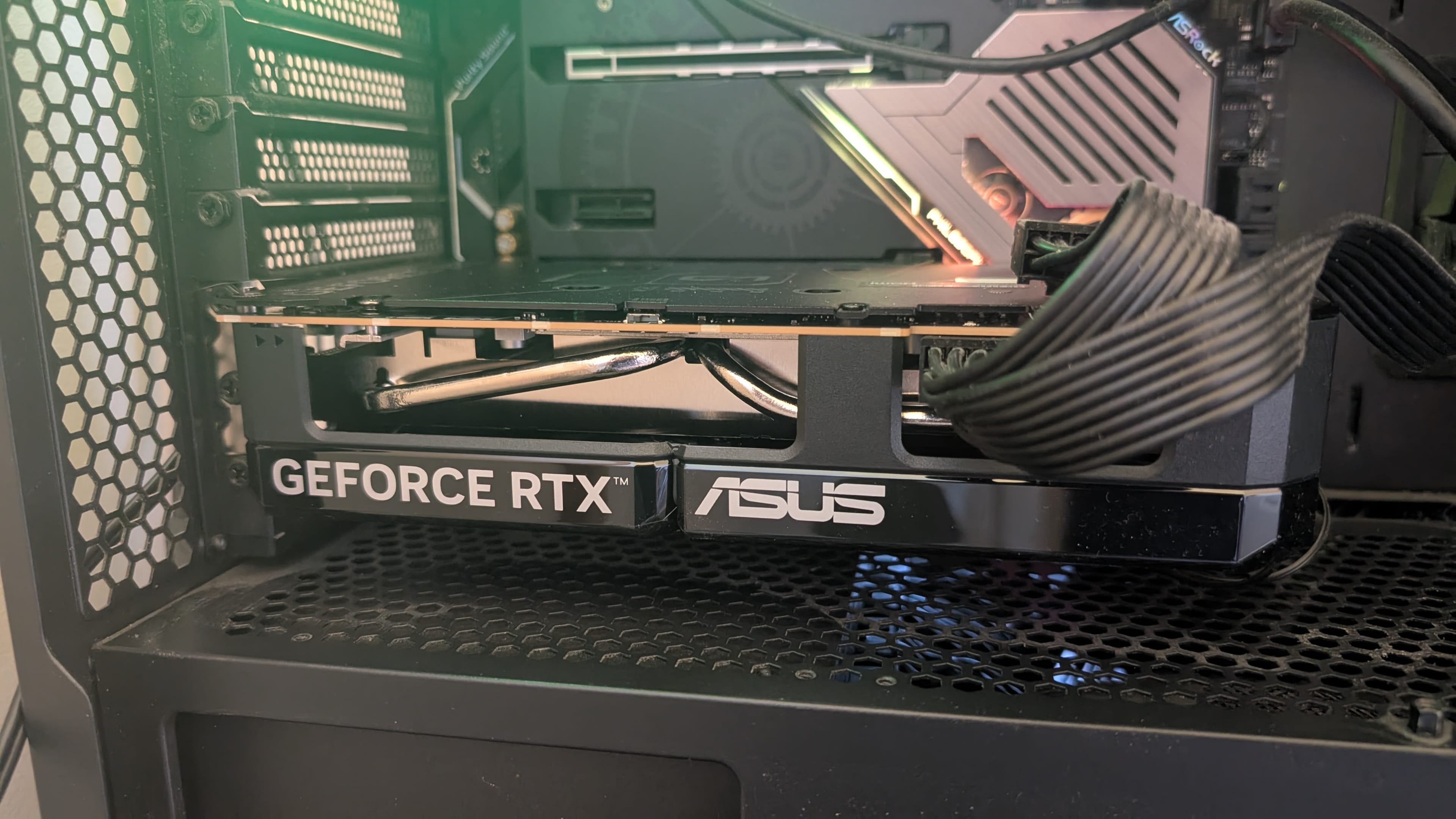 The Asus Dual OC RTX 5060 inside a PC case.