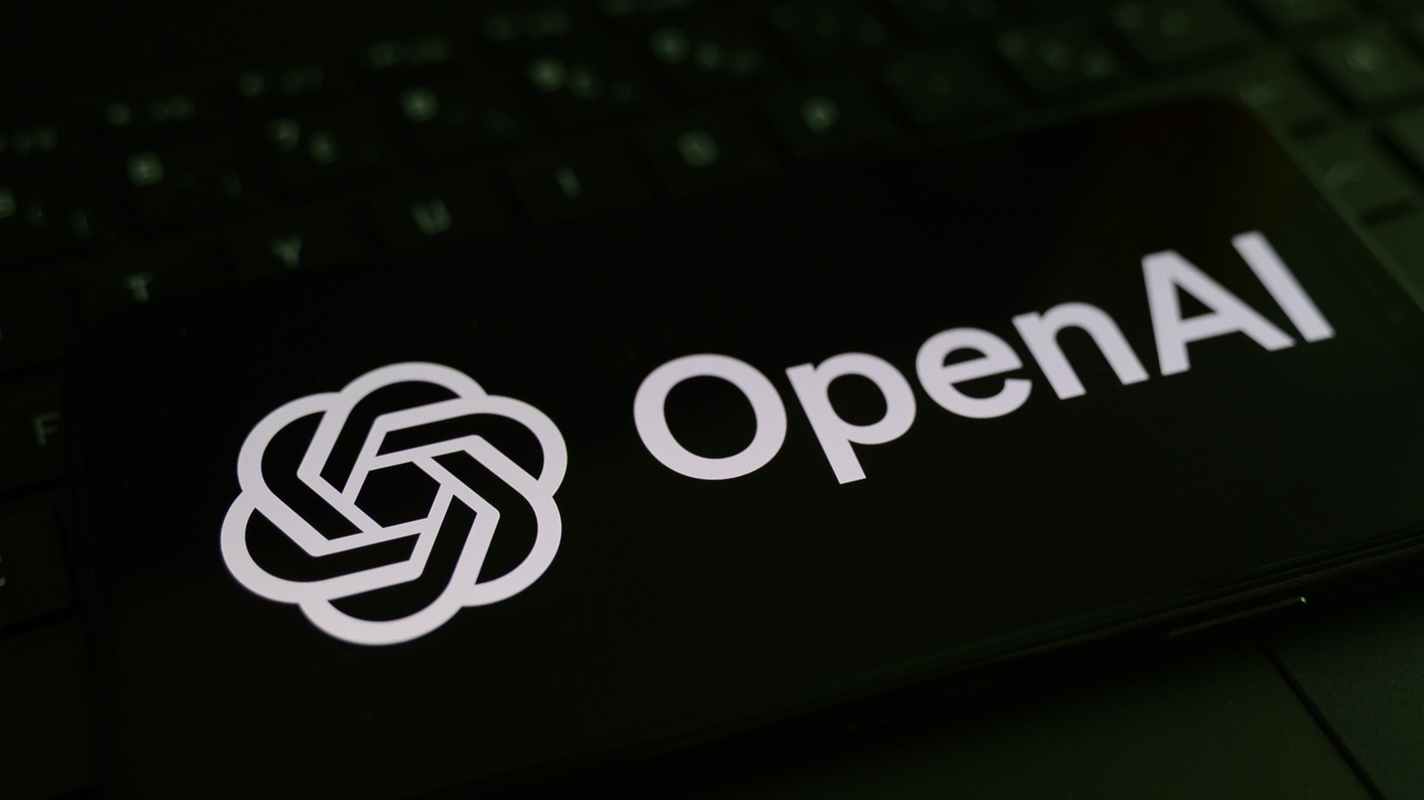 OpenAI logo displayed on a digital screen