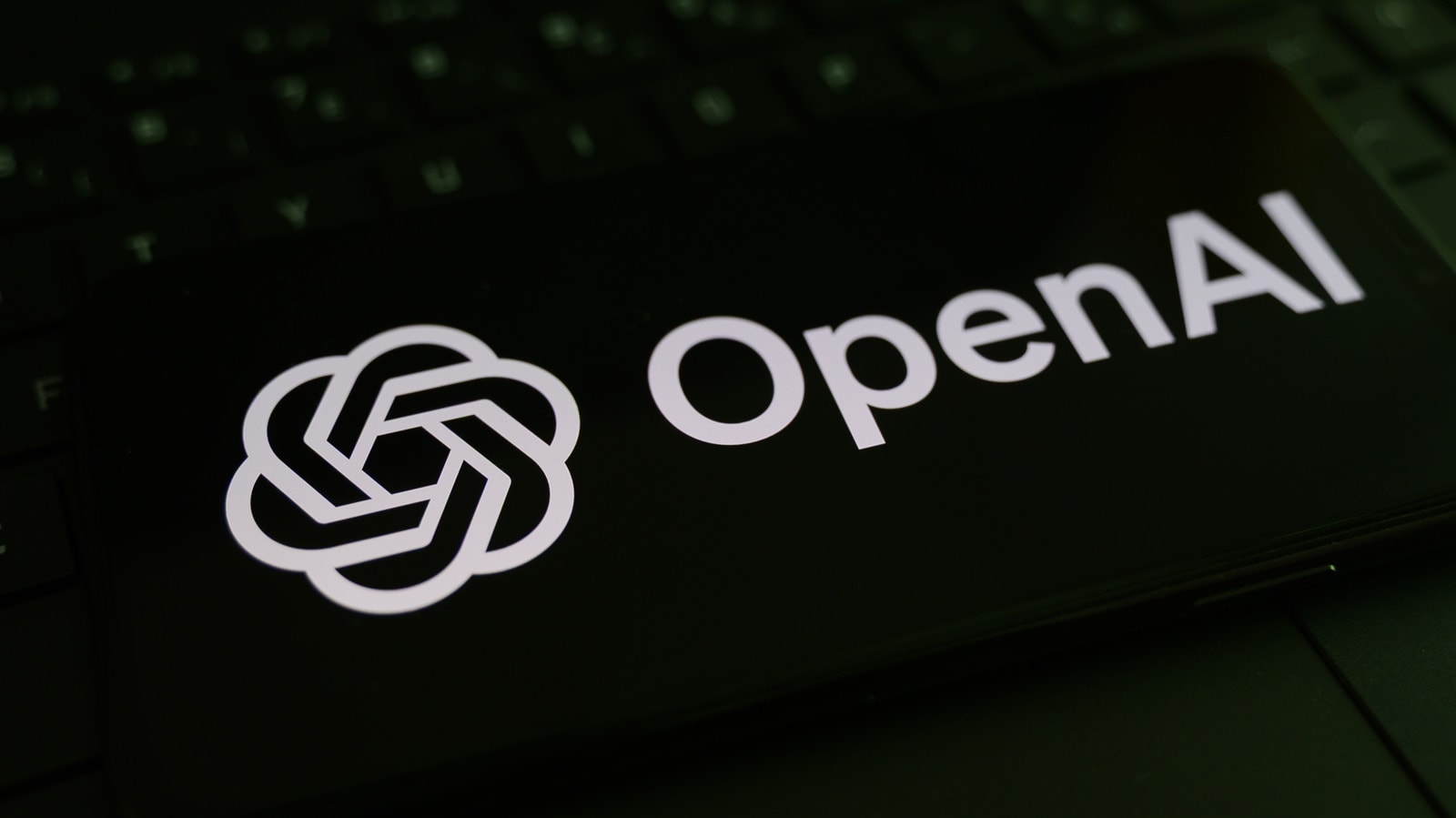 OpenAI logo and abstract scientific research visualization