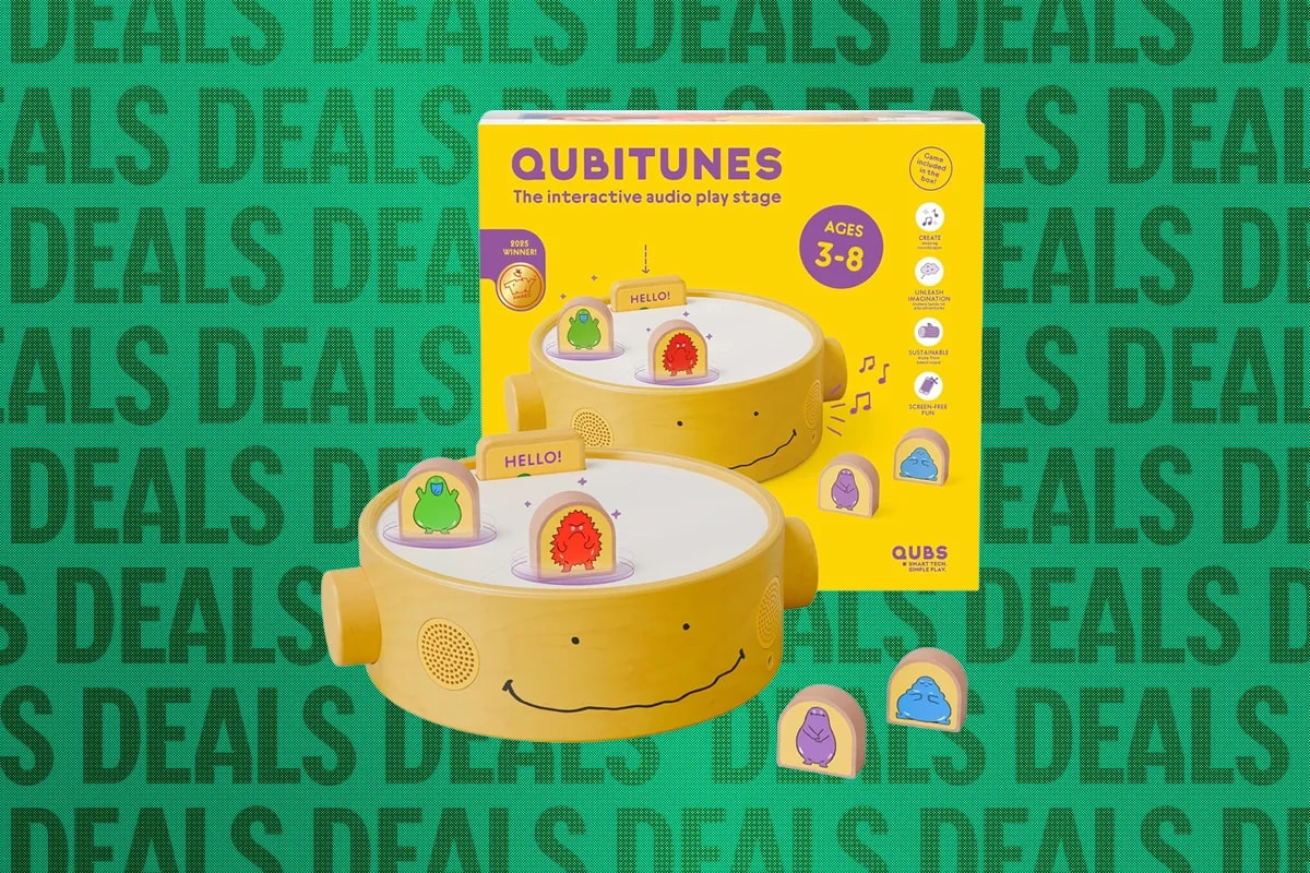 The Qubitunes device with wooden character figures on its circular stage.