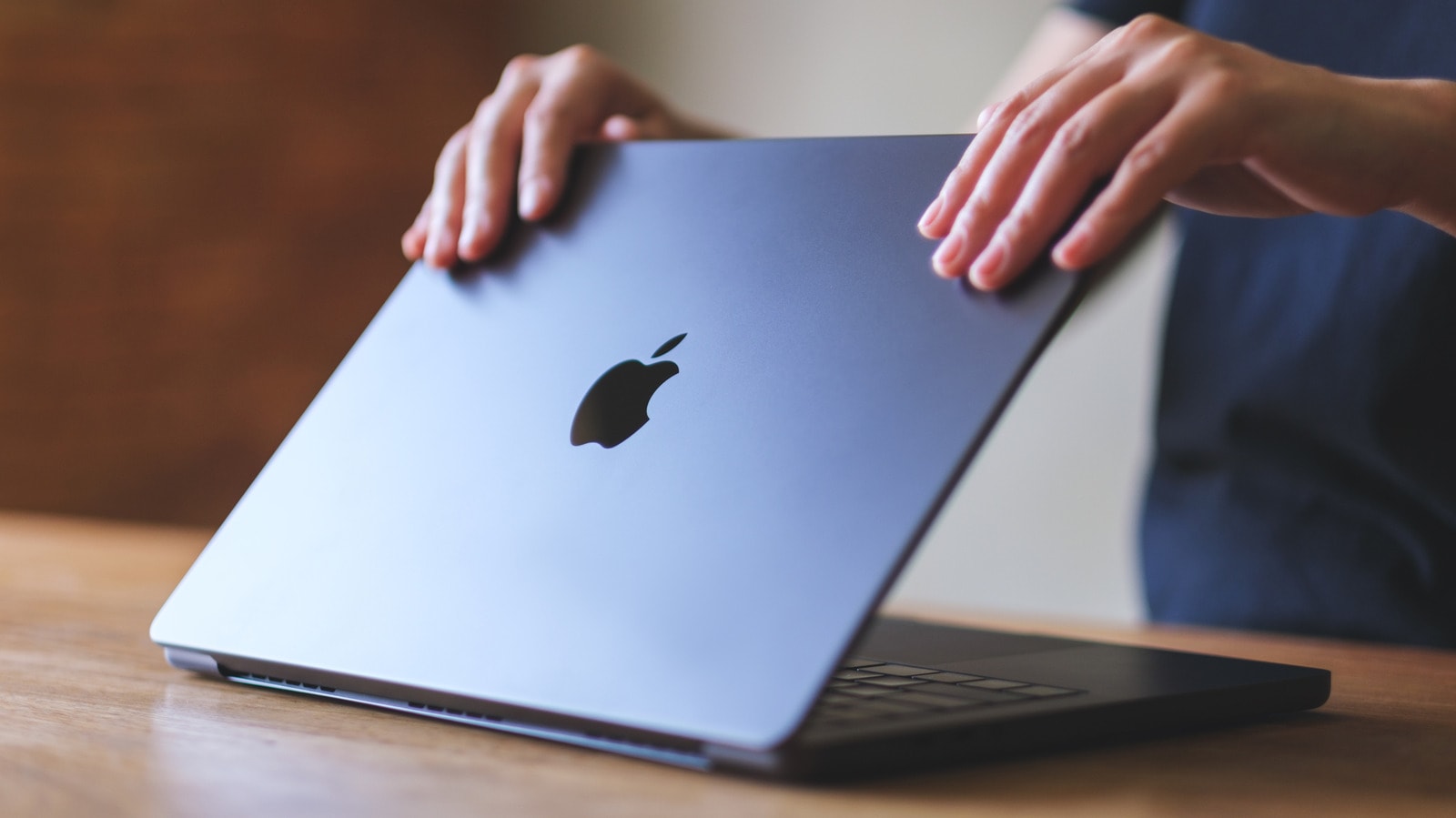 A closed MacBook laptop on a desk