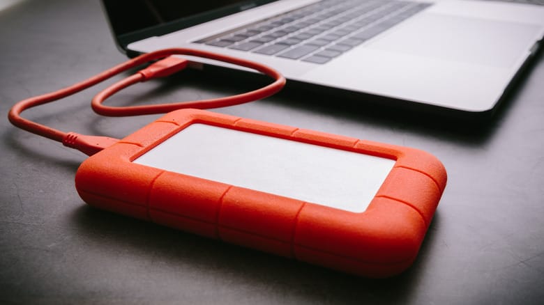 An external LaCie drive hooked up to a MacBook.