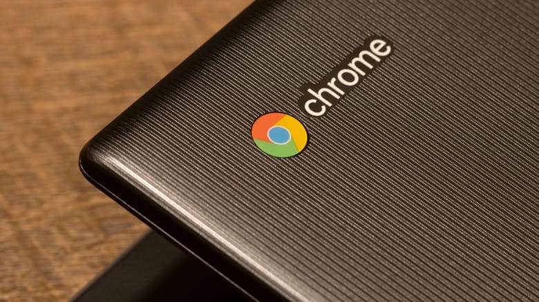 Corner of Chromebook showing Chrome logo.