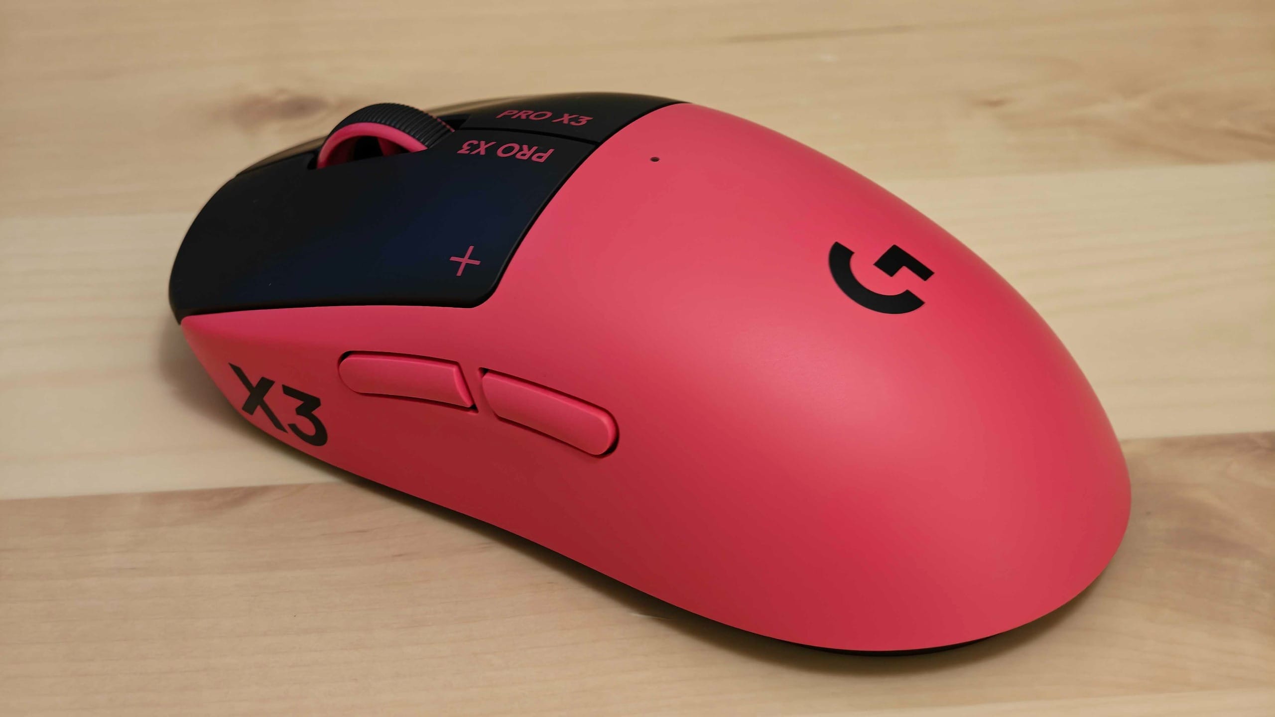 Logitech G Pro X3 Superstrike on a wooden table