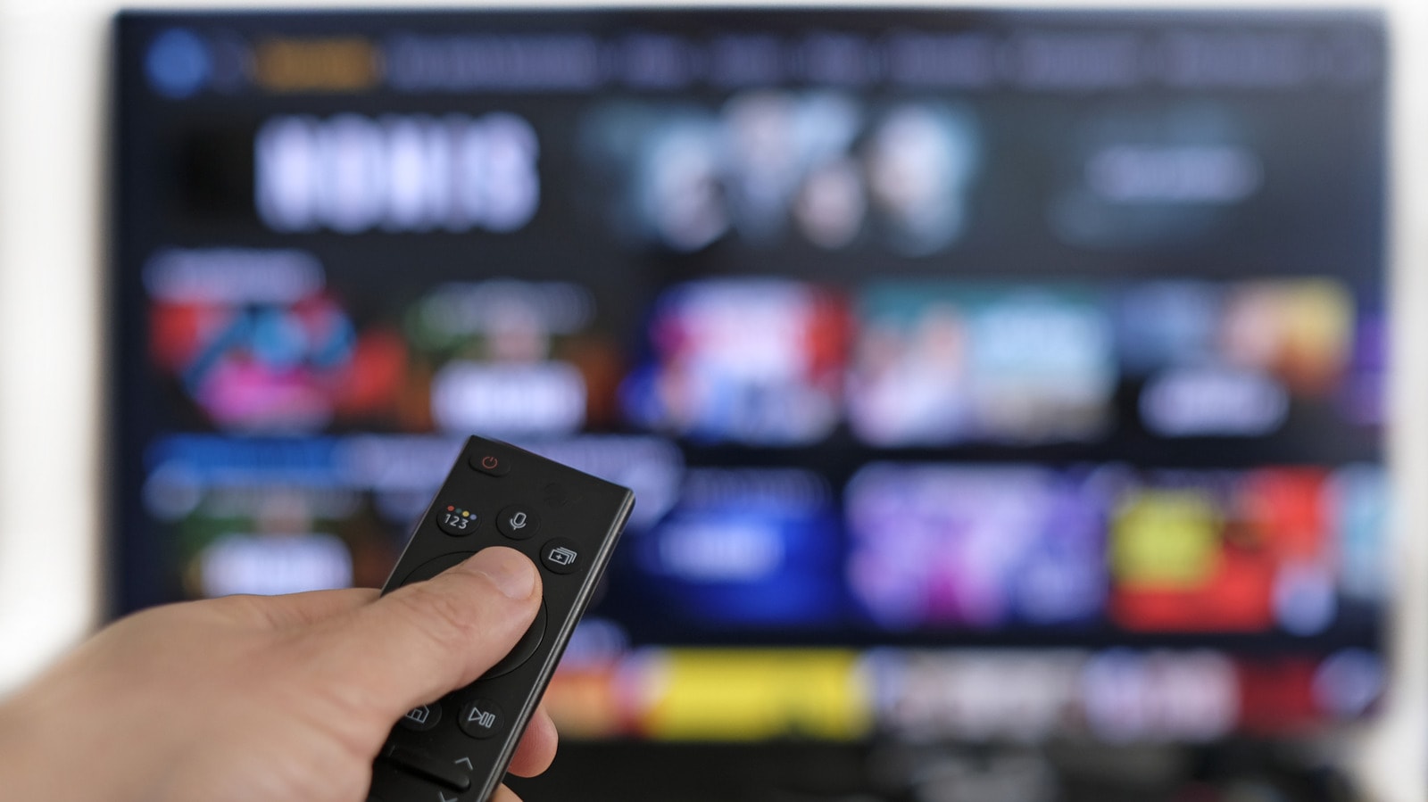 A modern Smart TV displaying streaming apps in a living room