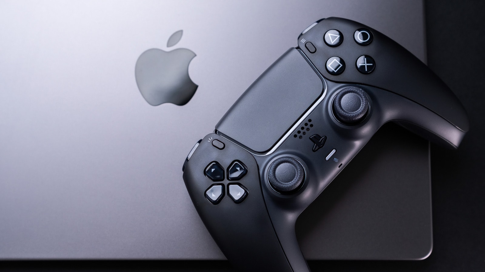 A modern MacBook displaying a high-end video game