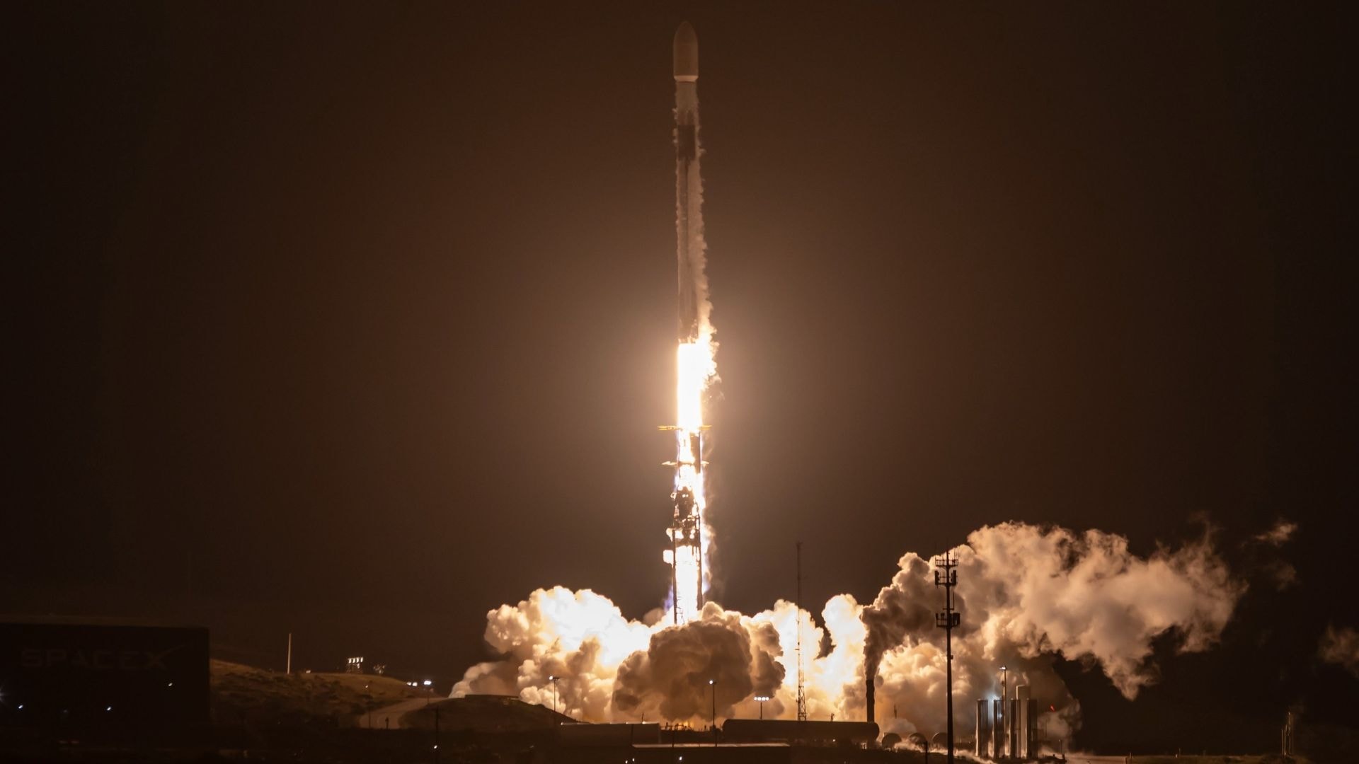A SpaceX Falcon 9 rocket preparing for launch at Vandenberg Space Force Base.