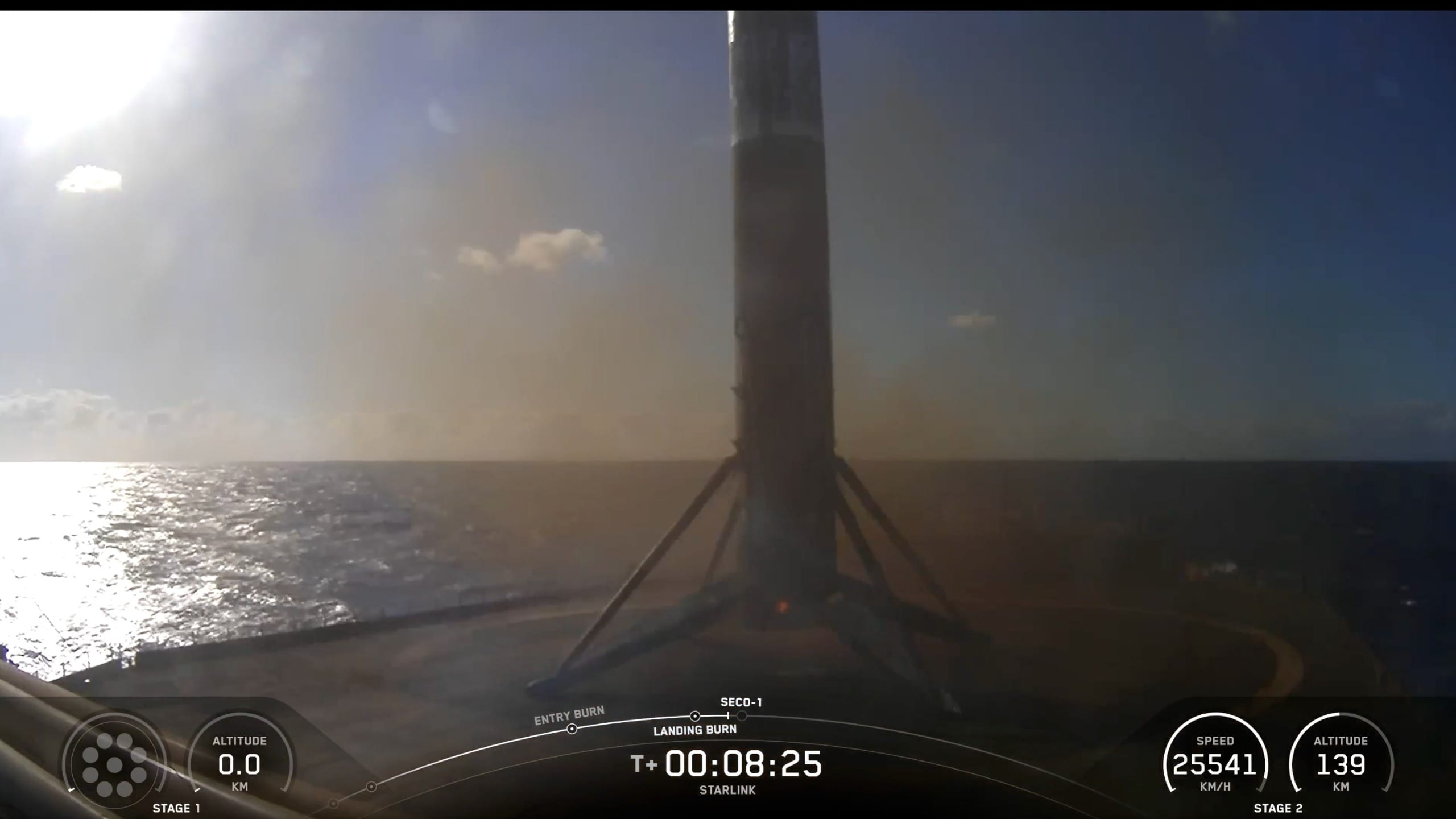 a black and white rocket rest on the deck of a ship at sea