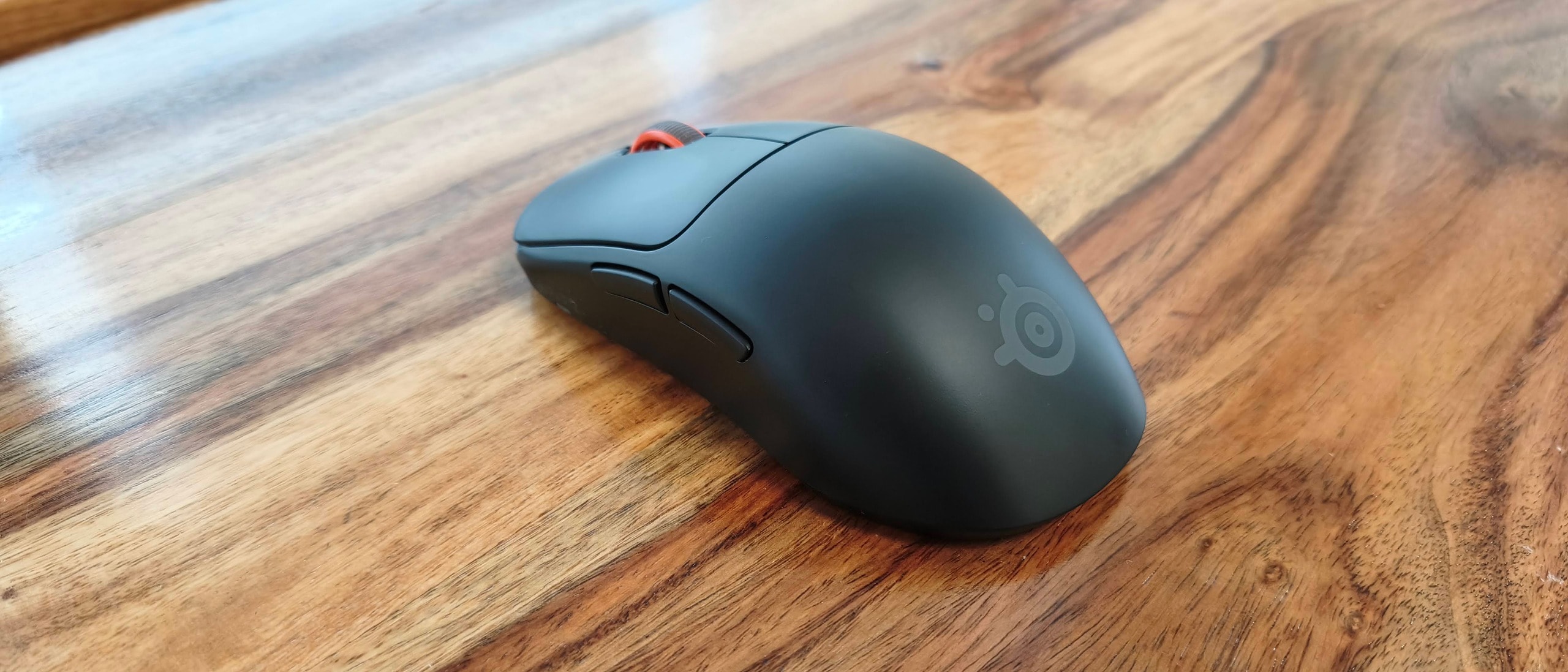 SteelSeries Sensei Pro gaming mouse on a desk