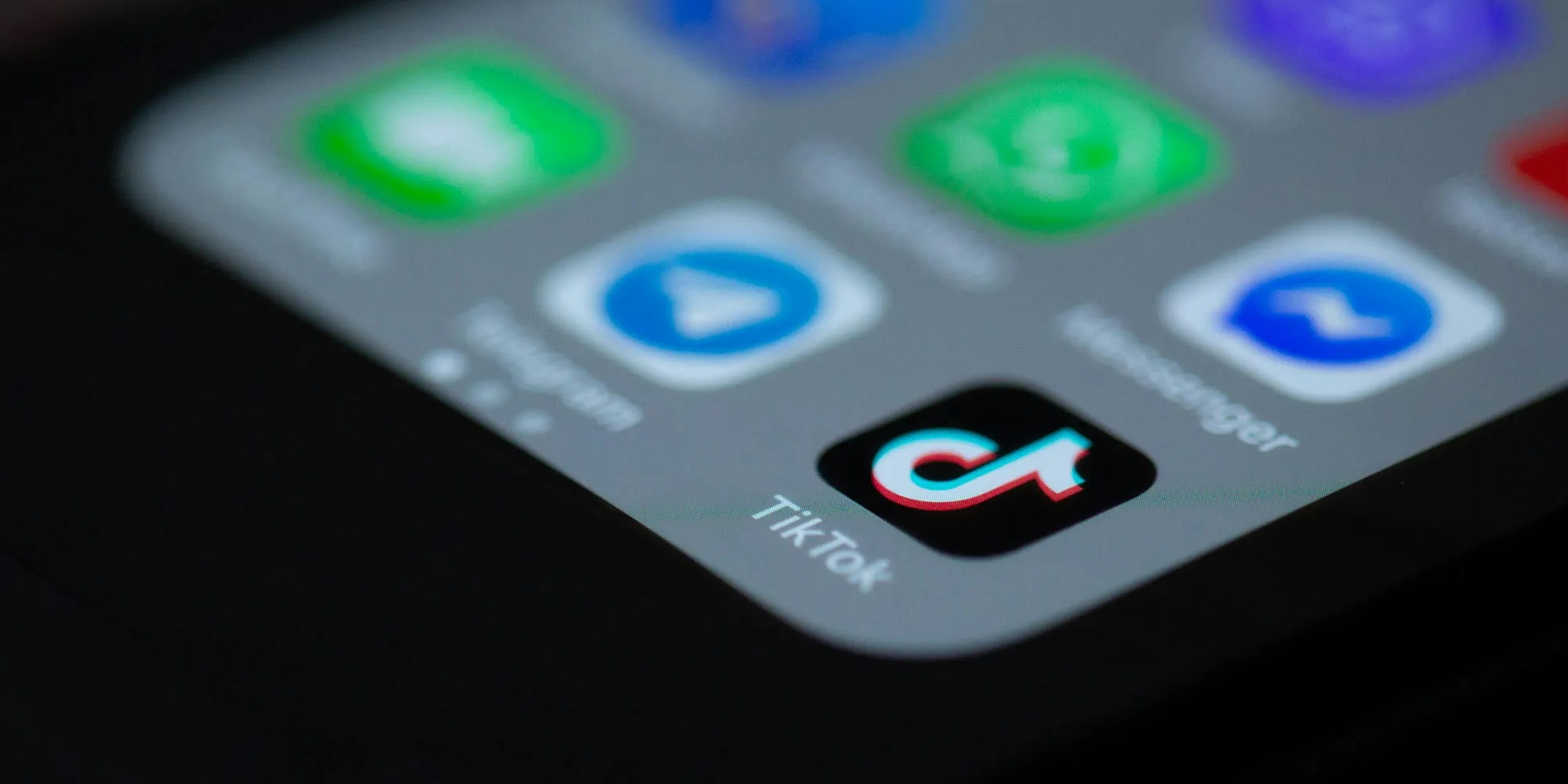 TikTok logo on a smartphone screen
