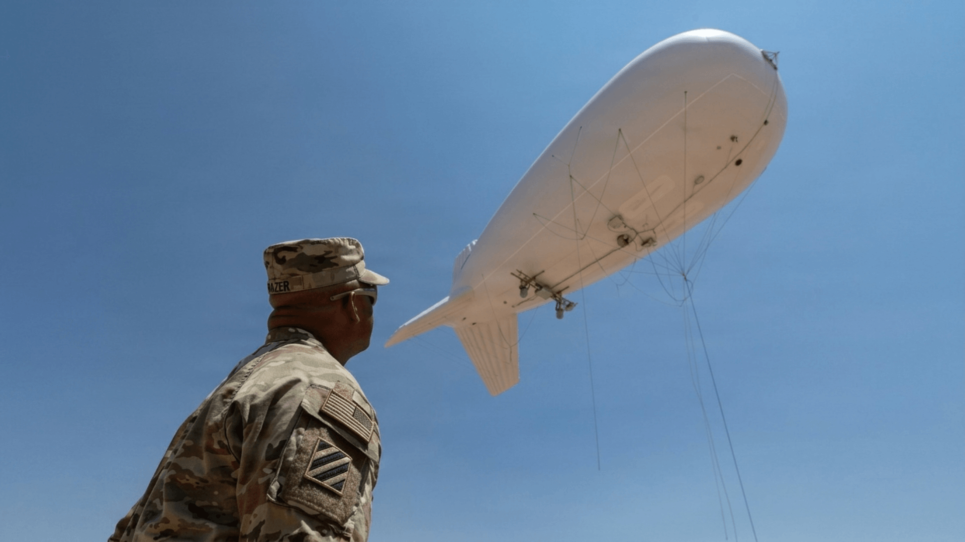 A conceptual illustration of a drone attached to a high-altitude balloon.