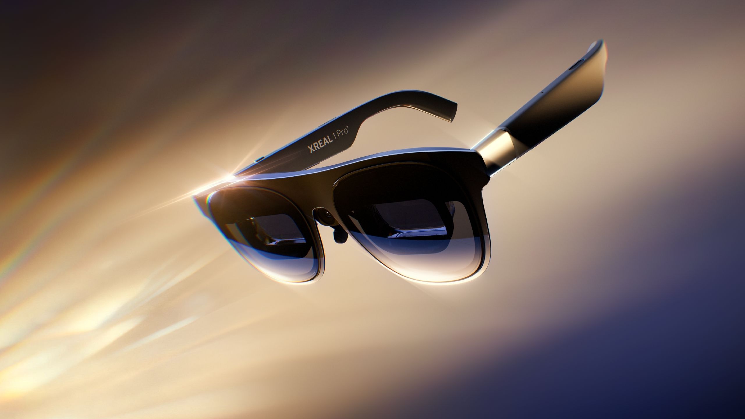 Xreal 1 Pro+ AR glasses on a neutral background