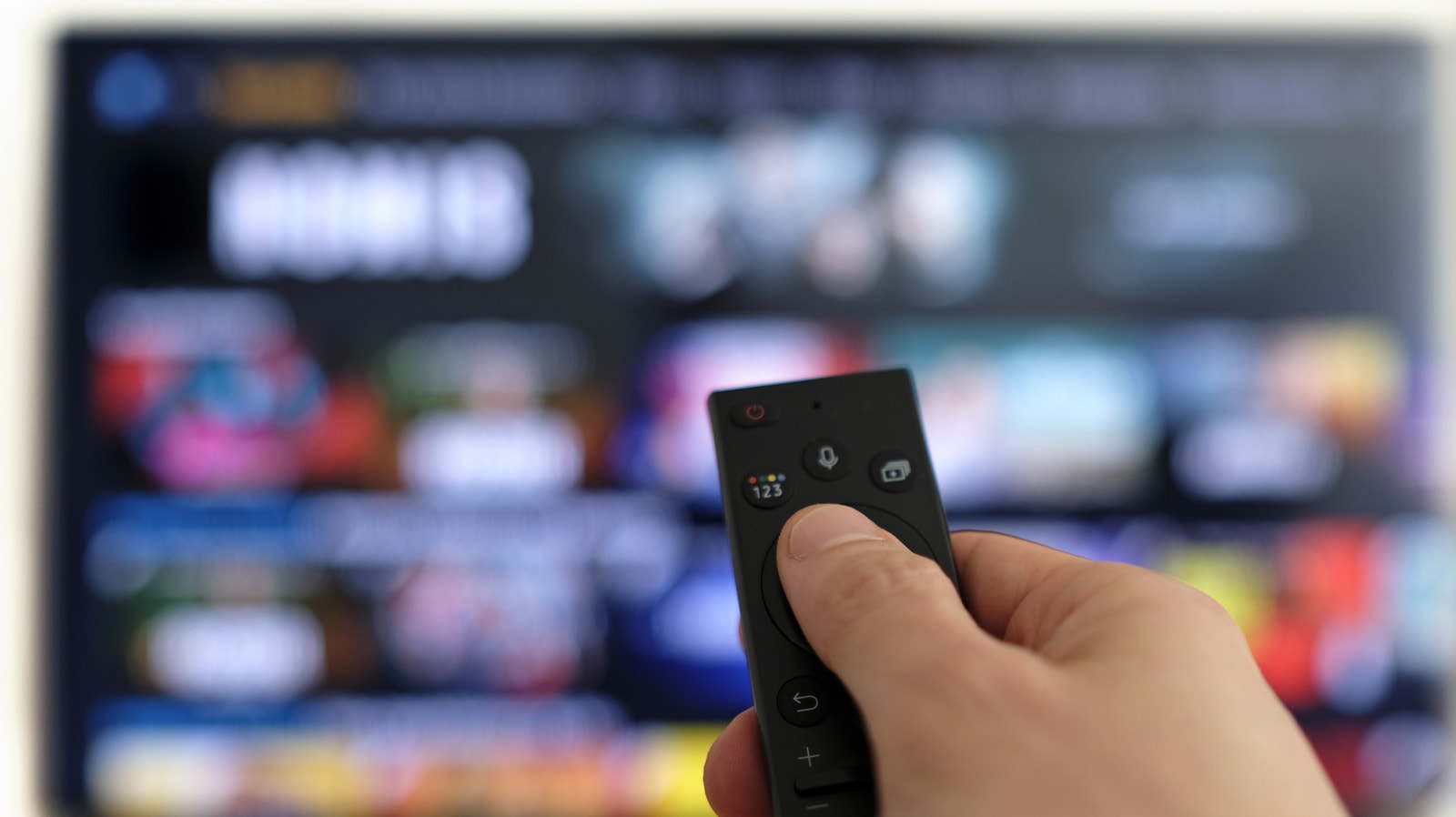 YouTube logo displayed on a television screen in a living room.