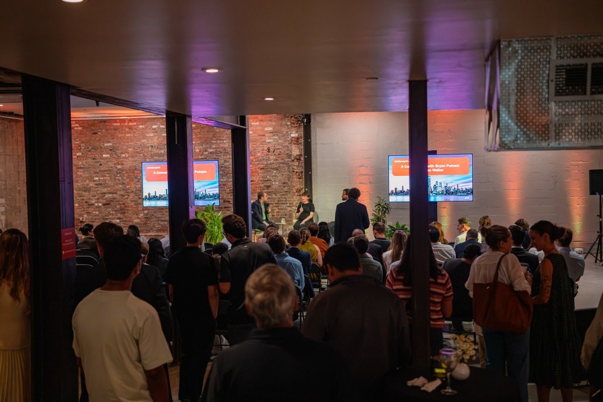 People gathering and talking face-to-face in a modern physical space