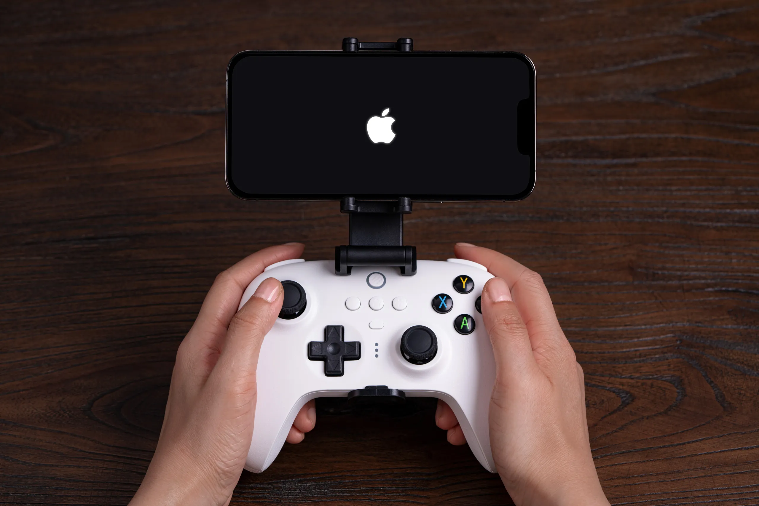 Apple and Beats logos alongside a smartphone game controller