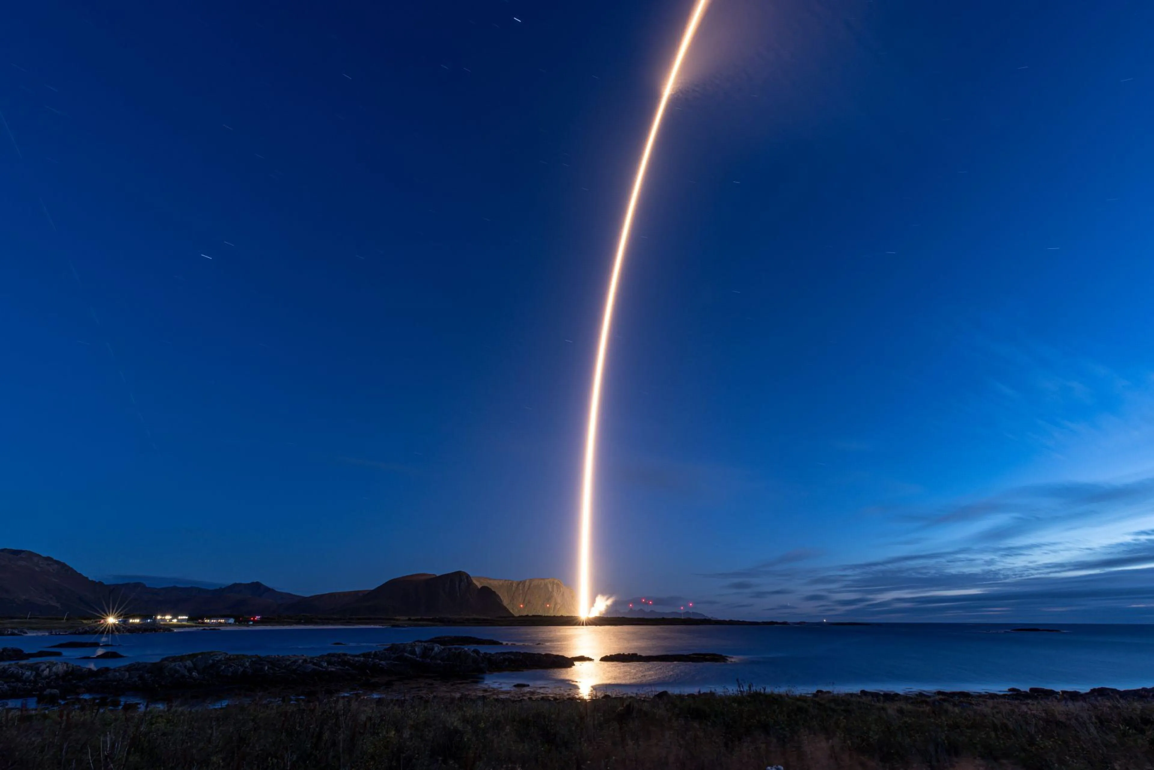 Isar Aerospace Spectrum rocket launching into orbit from a spaceport in Norway.